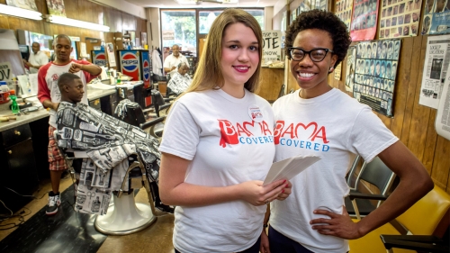 Photo of Ashleigh Staples and Chidinma Anakwenze in a Birmingham barber shop